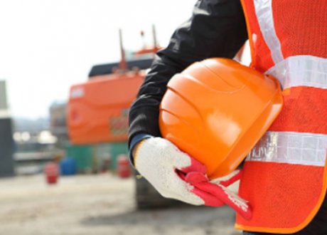 construction worker holding a hard hat